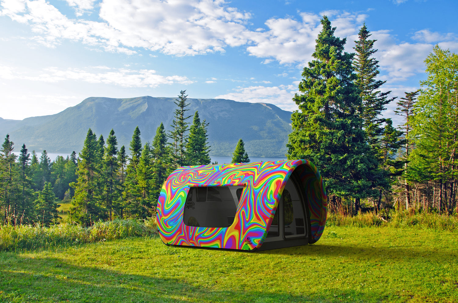 Good inTents Rainbow tent on green grass above a lake near mountains