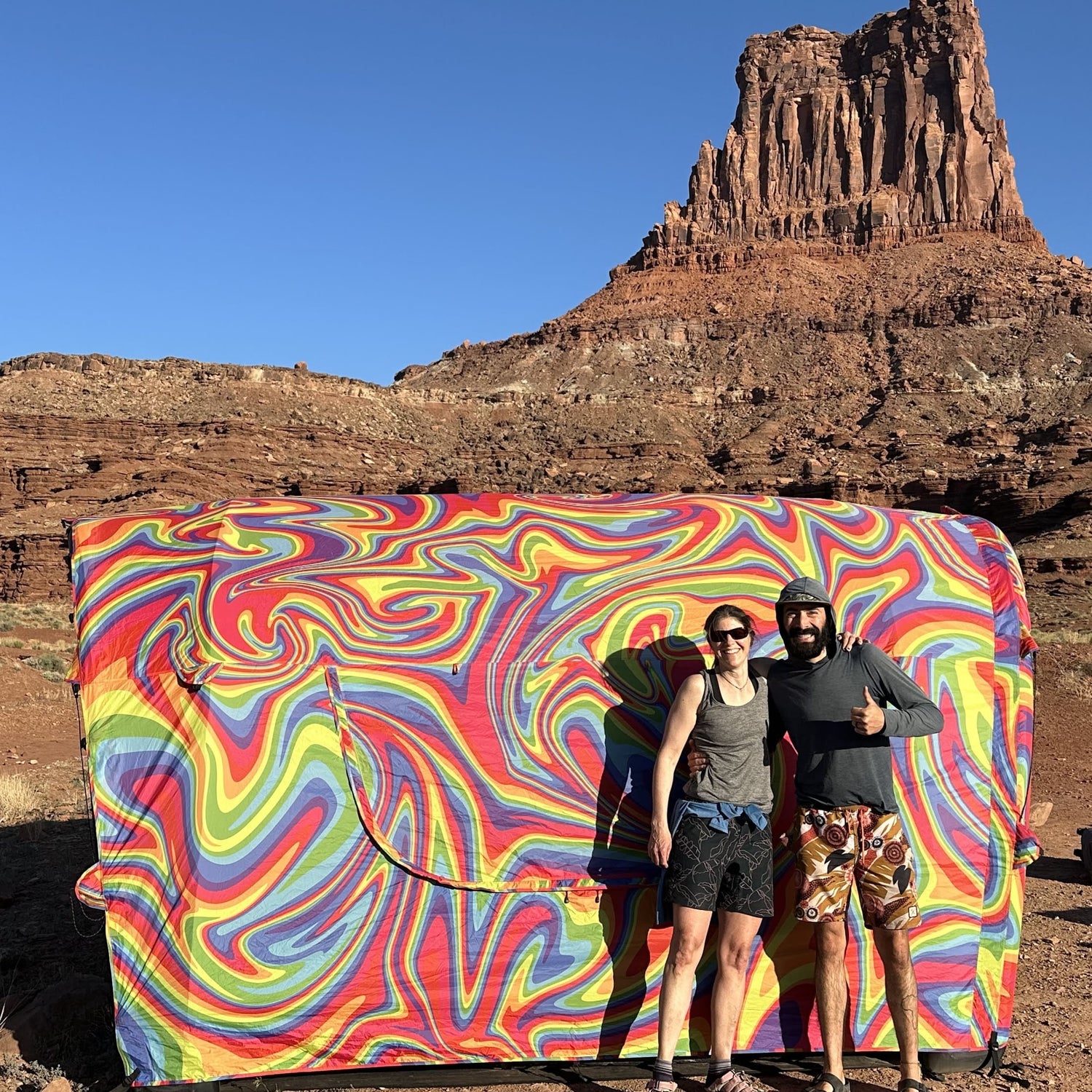 Lifestyle photo of people with a Rainbow Connection Tent in the desert southwest